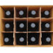 Overhead view of a twelve bottle case of red wine over a white background.